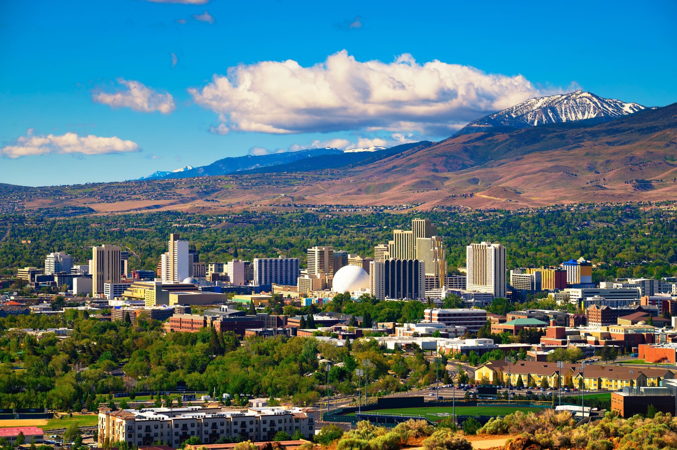 Reno cityscape with mountains in background.