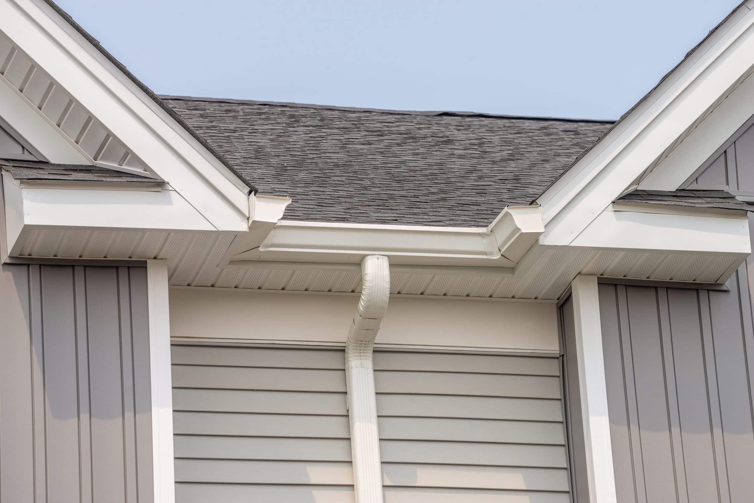Close-up of house siding and roof structure.