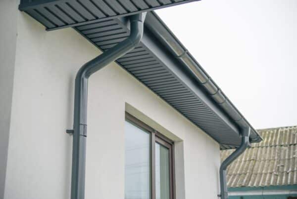 Modern house with gray gutter system.